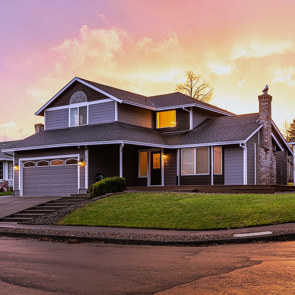 A side view of a suburban house during sunset