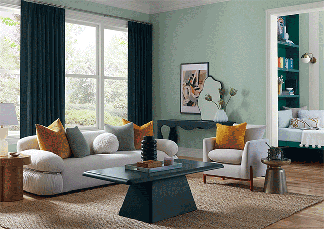 Trendy living room and bedroom painted in Slow Green.