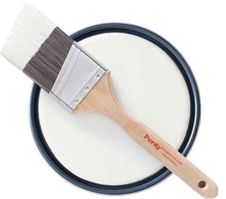 Topview of Purdy brush laying on open paint can showing White Sand paint.