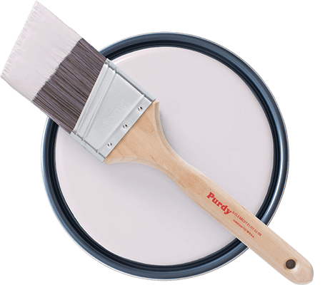 Topview of Purdy brush laying on open paint can showing Lite Lavender paint.
