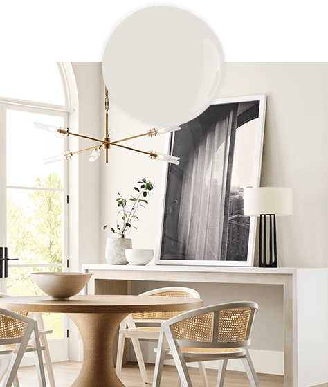 Paint dollop and photo of trendy room, with small dining table, chairs and console table, painted in Sunbleached.