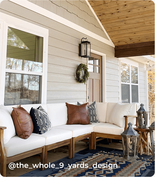 Decorated outdoor covered patio with siding painting Intellectual Gray. Photo courtesy of @the_whole_9_yards_design.
