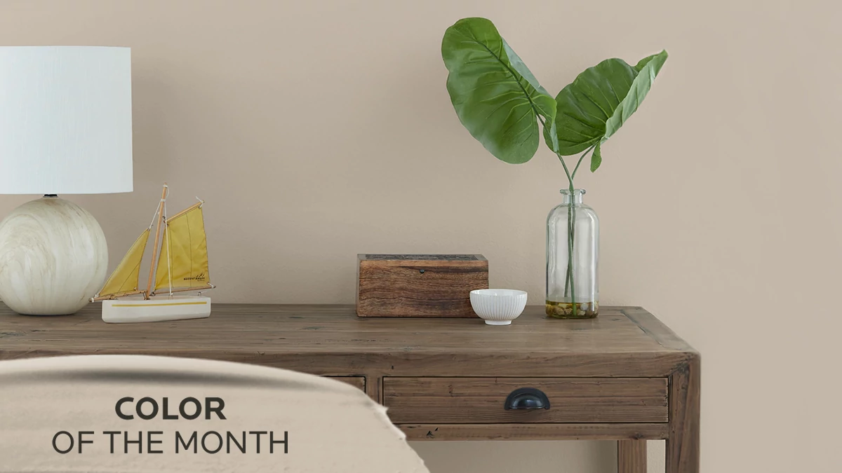 Color of the Month. Console table with home decor along wall painted in Shiitake.