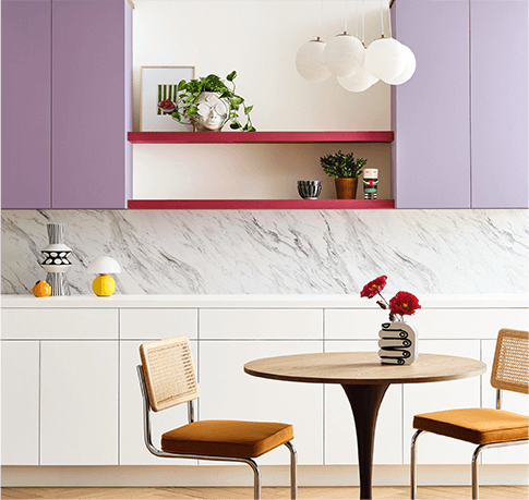 Breakfast table within kitchen with upper cabinates painted in Radiant Lilac.