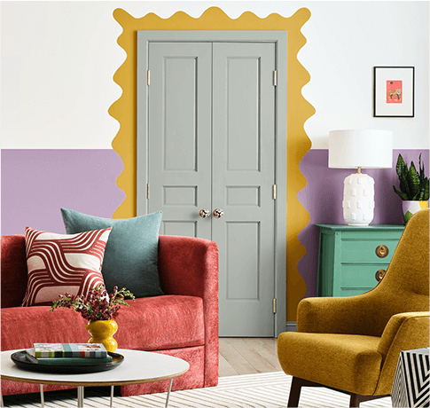 Dramatic living room with colorful furniture. Lower half of the wall painted in Radiant Lilac.