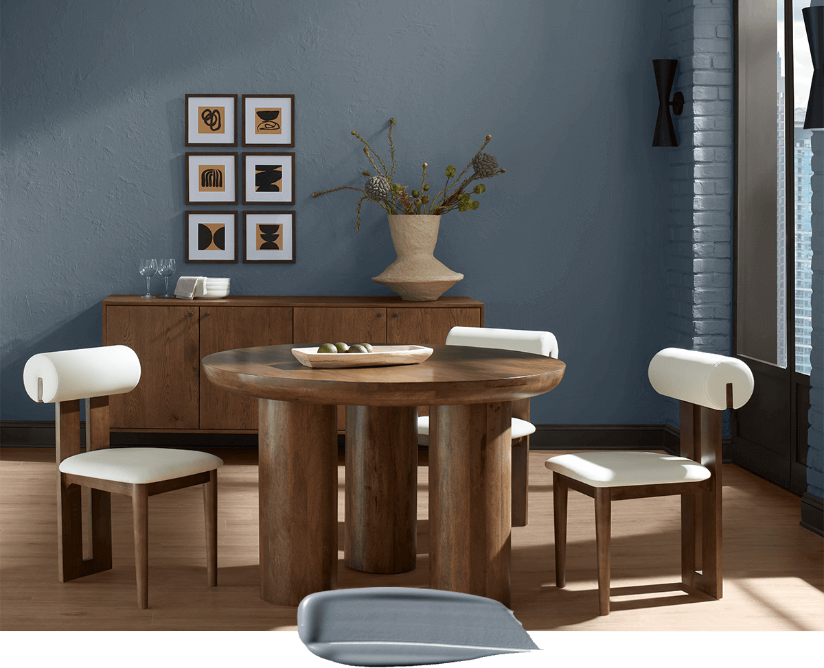 Paint swipe overlaying photo of a mid-centruy modern dining room painted in Storm Cloud.