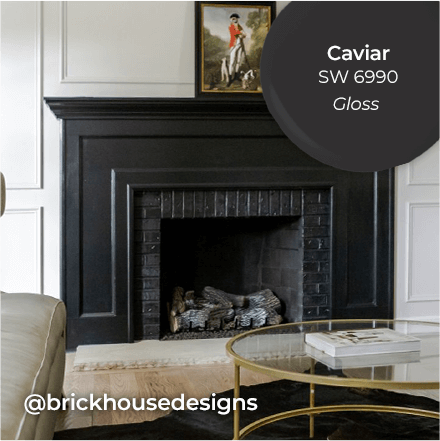 Livingroom with fireplace painted in Caviar. @brickhousedesigns.