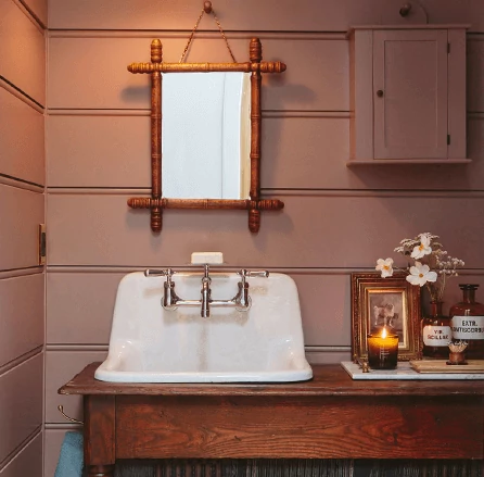 Rustic bathroom with wood walls painted in Cocoa Berry.