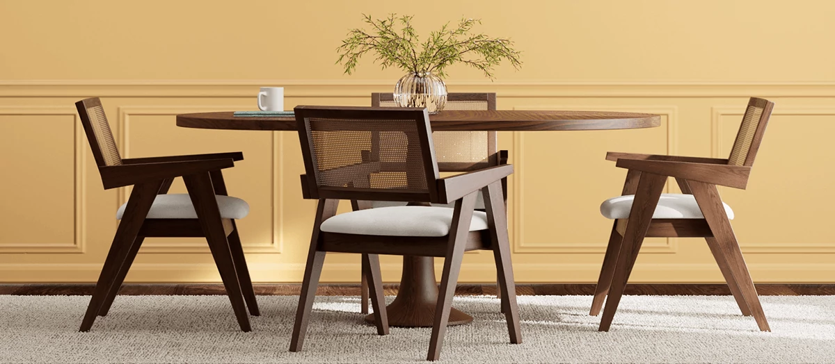 Dark wood dining table set, on white rug, in front of a wall painted in White Raisin.