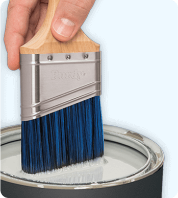 Purdy brush dipped in paintcan.