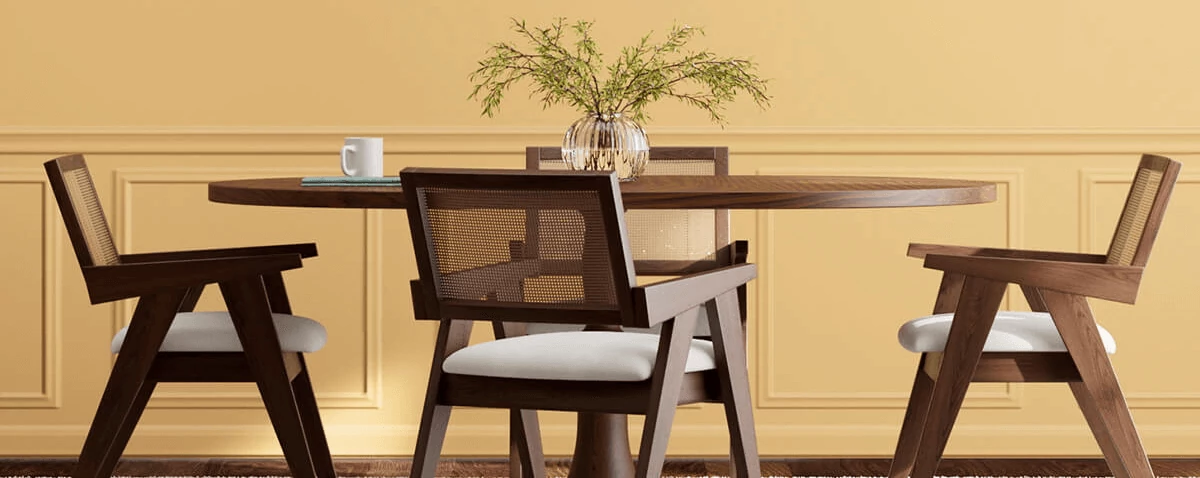 Dark wood round table with 4 mid-century modern chairs in room painted in White Raisin.
