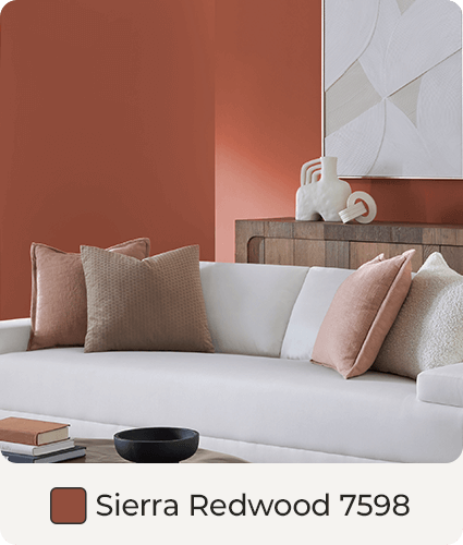 Contemporary wood bed, with white duvet and neutral pillows, in bedroom painted in Sierra Redwood. Color Swatch. Sierra Redwood SW 7598.