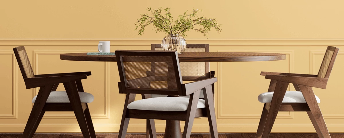 Dark wood round table with 4 mid-century modern chairs in room painted in White Raisin.