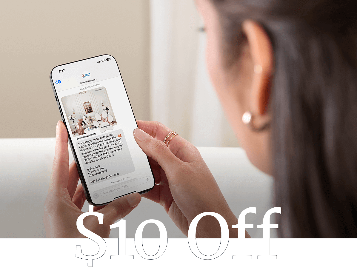 A woman viewing a smartphone with text messages about paint and stains savings. $10 off.