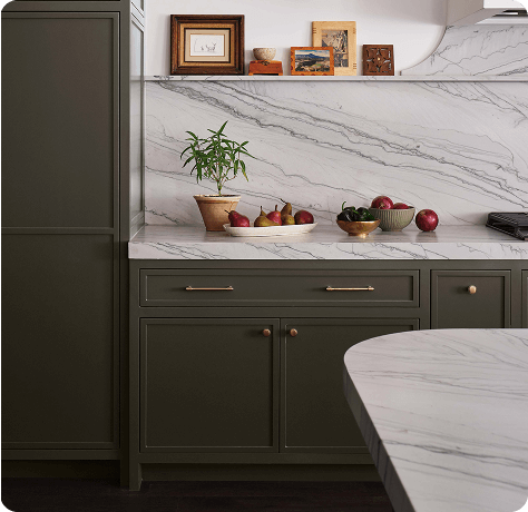 Trendy kitchen with cabinets painted in Roycroft Bronze Green .