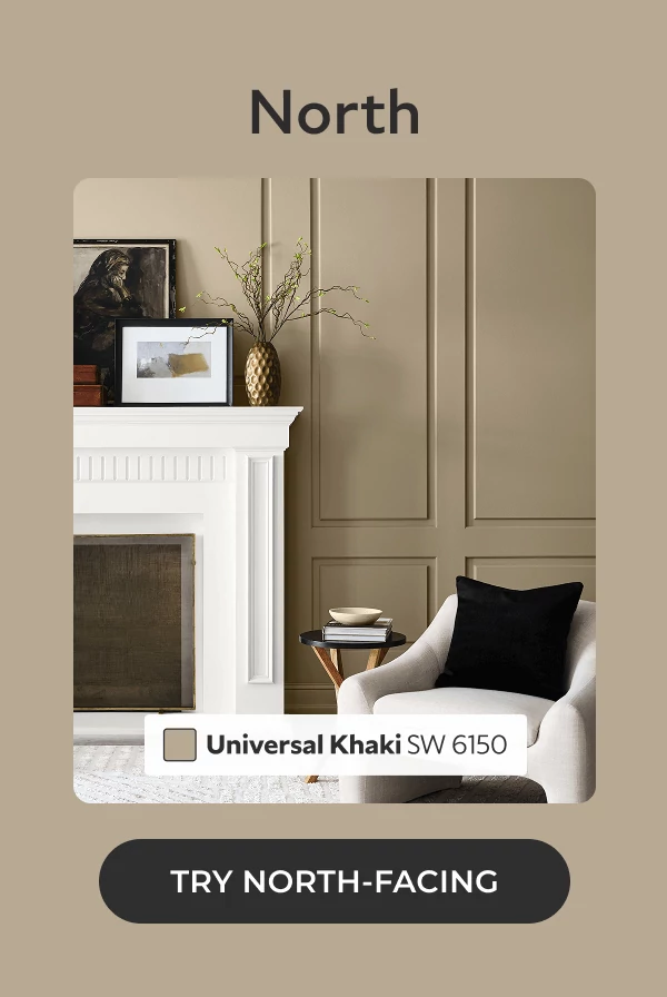 North. Living room, close-up of white fireplace and chair with black pillow, painted in Universal Khaki. Click to Try North-Facing.