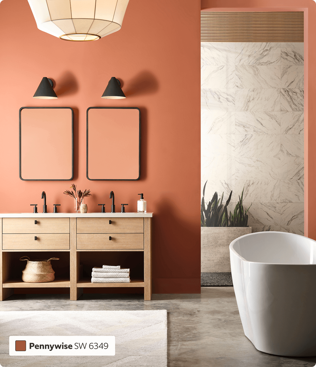 Modern bathroom, with freestanding white tub and blond wood 2 sink vanity with a mirror over each sink, painted in Pennywise.
