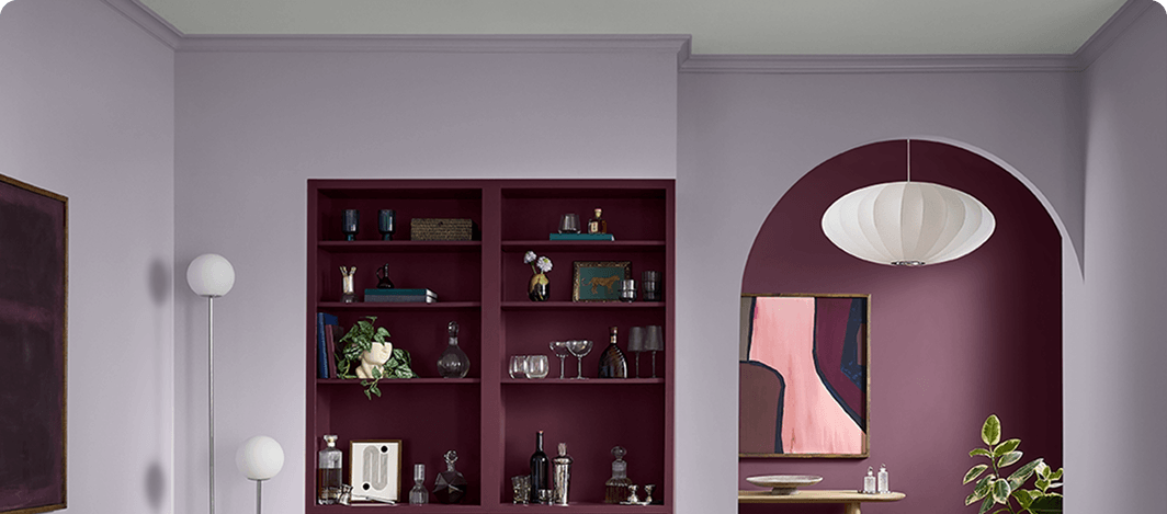 Modern light fixtures in trendy living room painted in Grape Mist with accents painted in supporting palette colors.