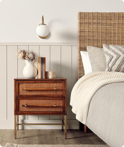 Bohemian-style bedroom with beadboard and wall painted in Heron Plume and Pachyderm.