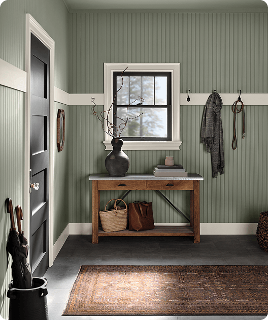 Entryway beadboard paneled wall painted in Evergreen Fog and Shoji White molding.