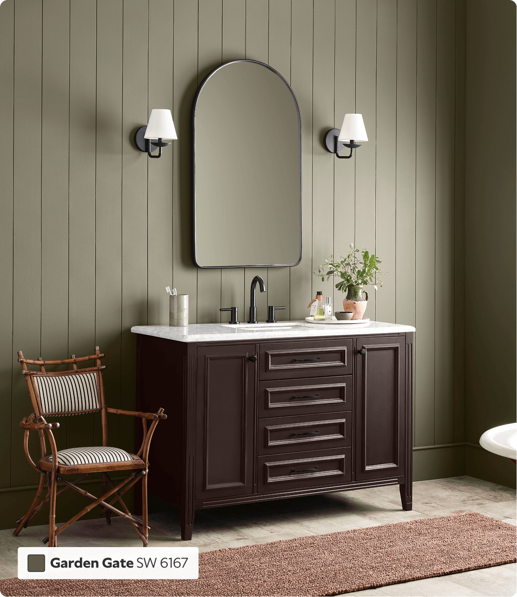 White countertop dark wood vanity, within beadboard walled bathroom painted in Garden Gate.