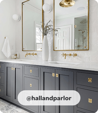 Peppercorn painted built-in double vanity with with white countertop and gold hardware in a modern bathroom. @hallandparlor.