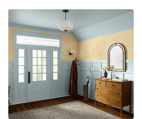 Country-style kitchen and entryway with cabinets, ceiling, wood panels, door and moulding painted in Tradewind.