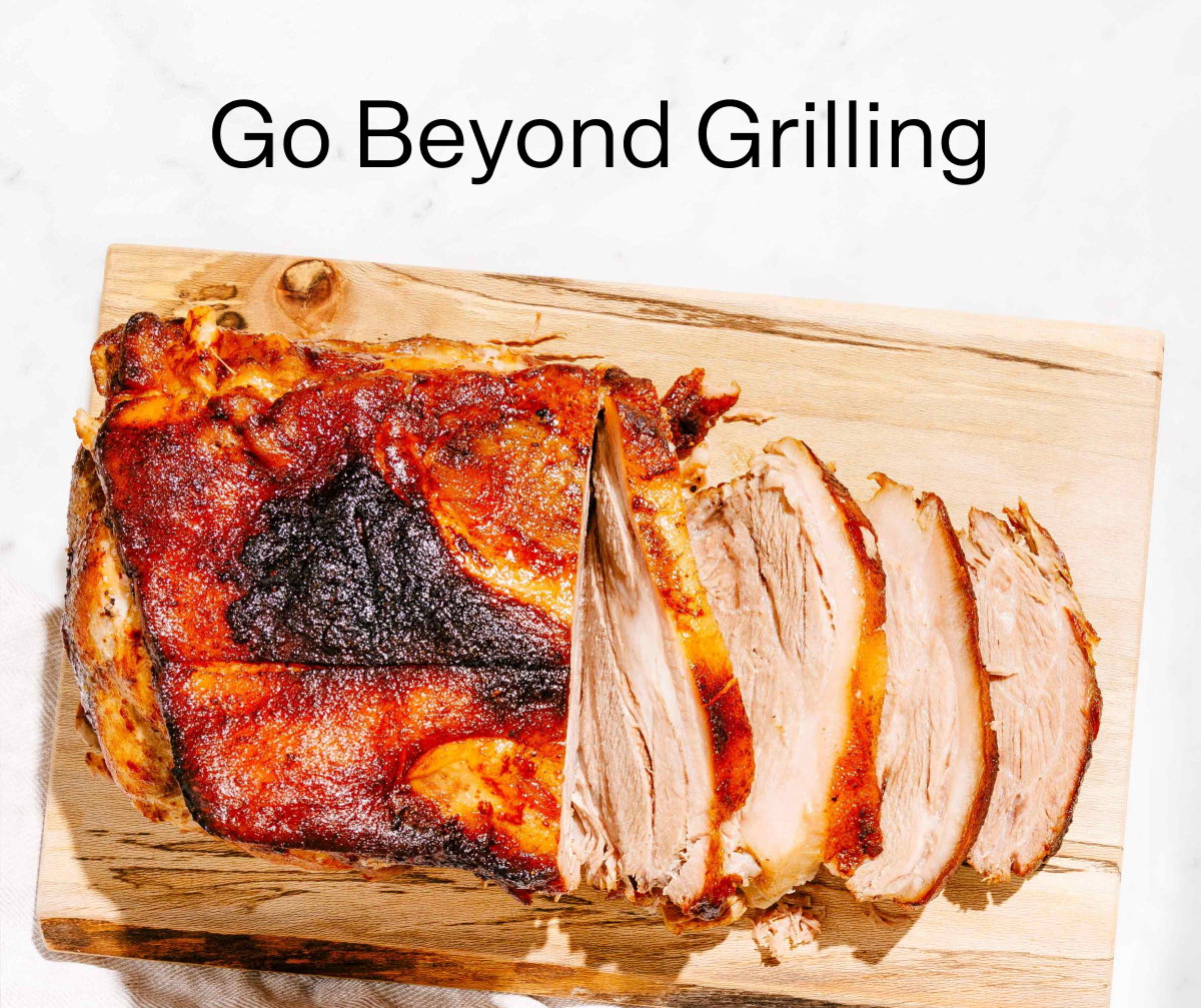 Header text reads, "Go Beyond Grilling" above a photo of bbq pork on a cutting board.