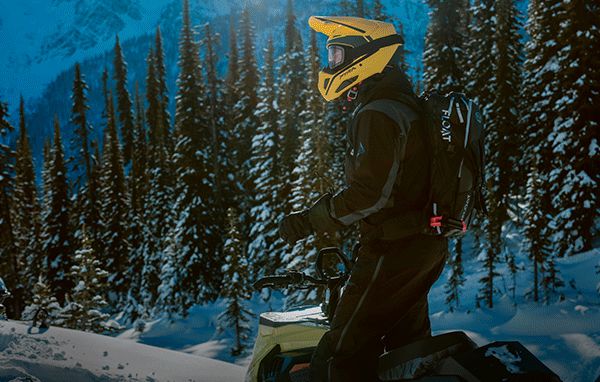 Riders on Ski-Doo snowmobiles