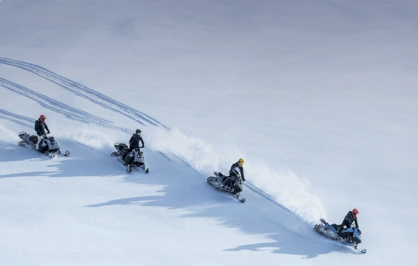 Ski-Doo snowmobiles in action