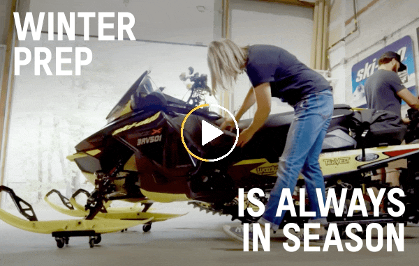 People prepping their Ski-Doo for winter