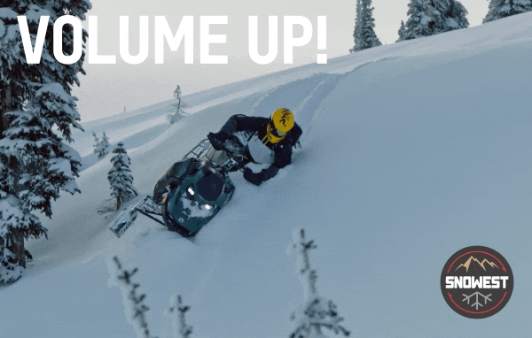 Person riding a Ski-Doo in powdered snow