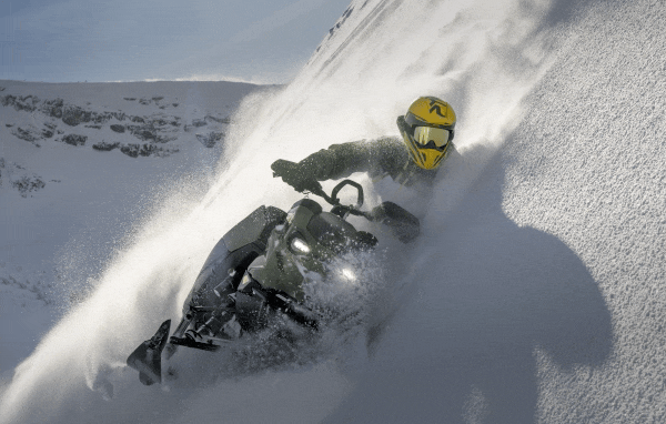 Person riding a Ski-Doo in deep snow