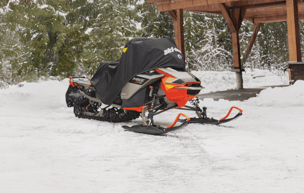 Snowmobiles wrapped in Ski-Doo covers
