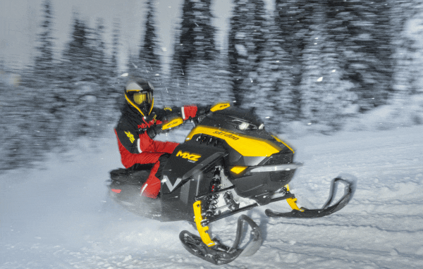 Rider on yellow and black sled