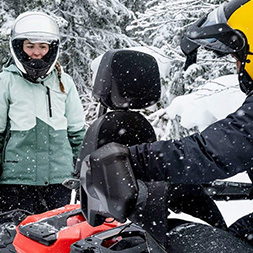 Rider putting Ski-Doo boot on