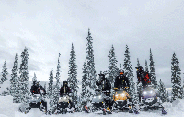 Row of Ski-Doo riders and their sleds