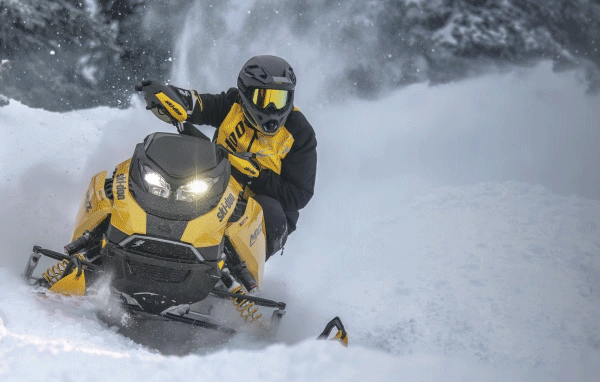 Riders turning and jumping on sleds