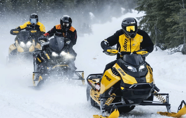 Three Ski-Doo riders