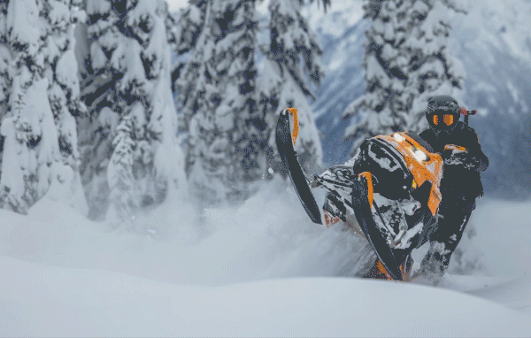 People doing stunts with Ski-Doo sleds