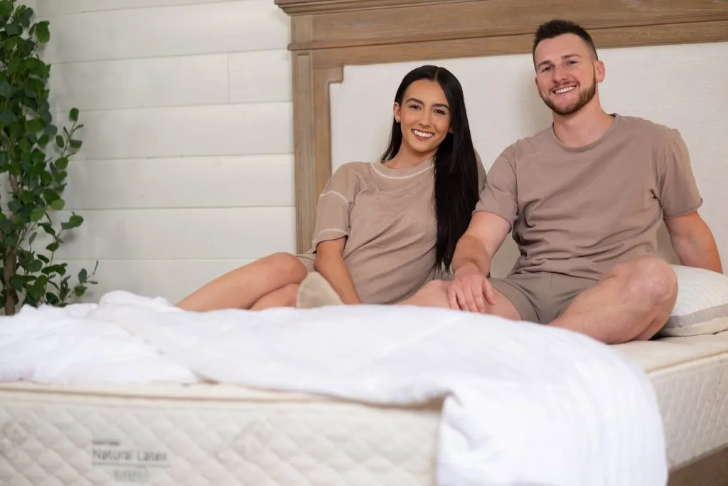 Couple relaxing on a SleepEZ latex mattress