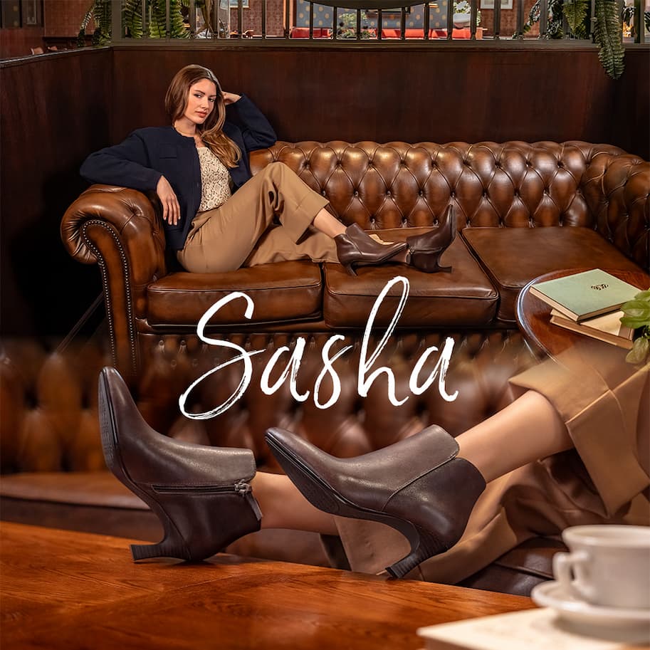 Model wearing Sofft's Sasha in Chocolate with text that reads "Sasha"