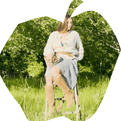 Sofft's Samantha II knee-high boots styled with a blue floral dress during apple picking, basket of apples nearby GIF