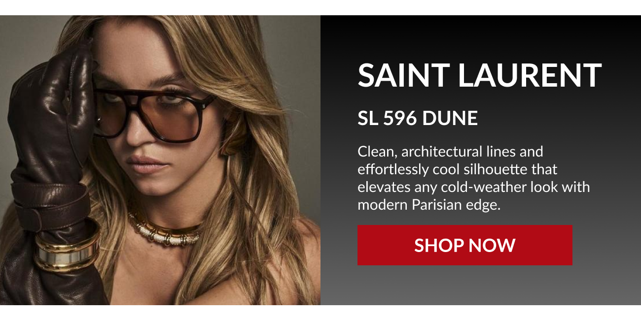 Saint Laurent SL 596 Dune sunglasses featured on a model wearing leather gloves and gold jewelry.