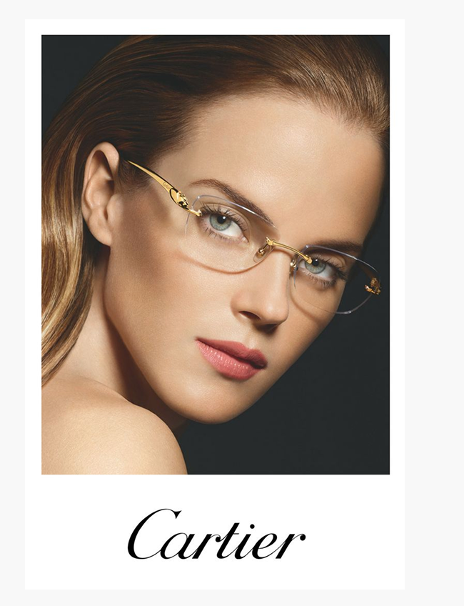 Model wearing Cartier rimless optical glasses with gold-tone details and signature panthère motif.