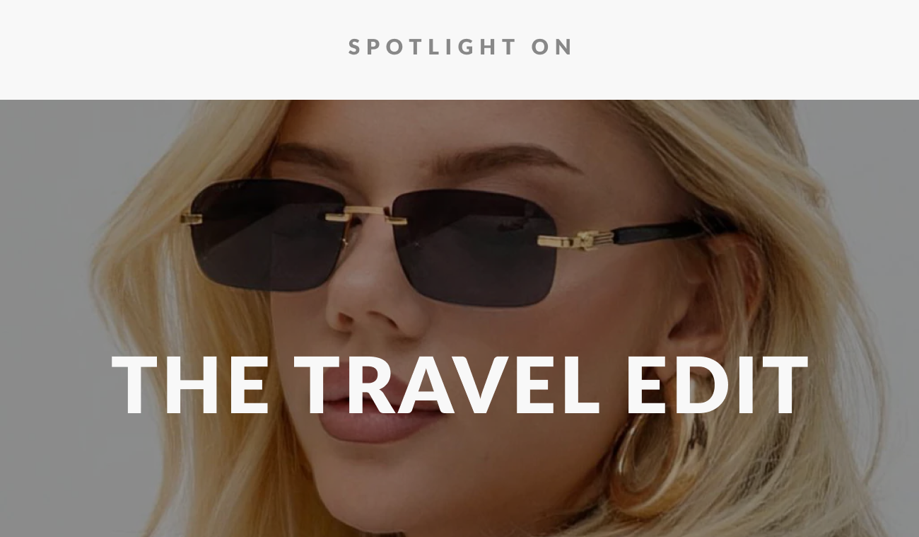 Lifestyle image of blonde model wearing black designer sunglasses featured in The Travel Edit collection.