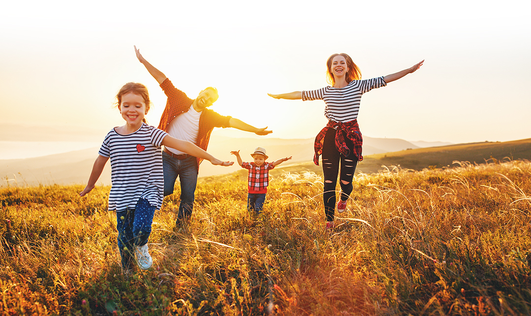 Happy family time: mother, father, children son and daughter on nature on sunset