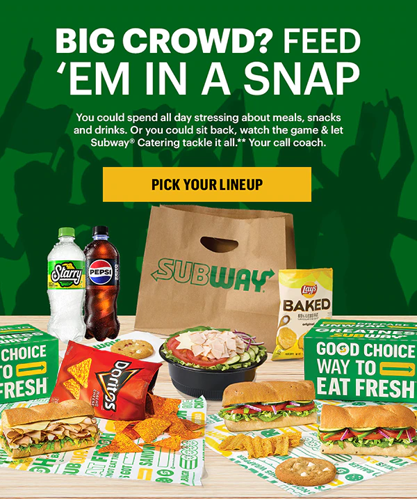 A variety of Subway® sandwiches, chips, and a salad are displayed on a table against a green backdrop. A Subway® bag and drinks are in the background. Bold text reads, "Big crowd? Feed 'em in a snap."