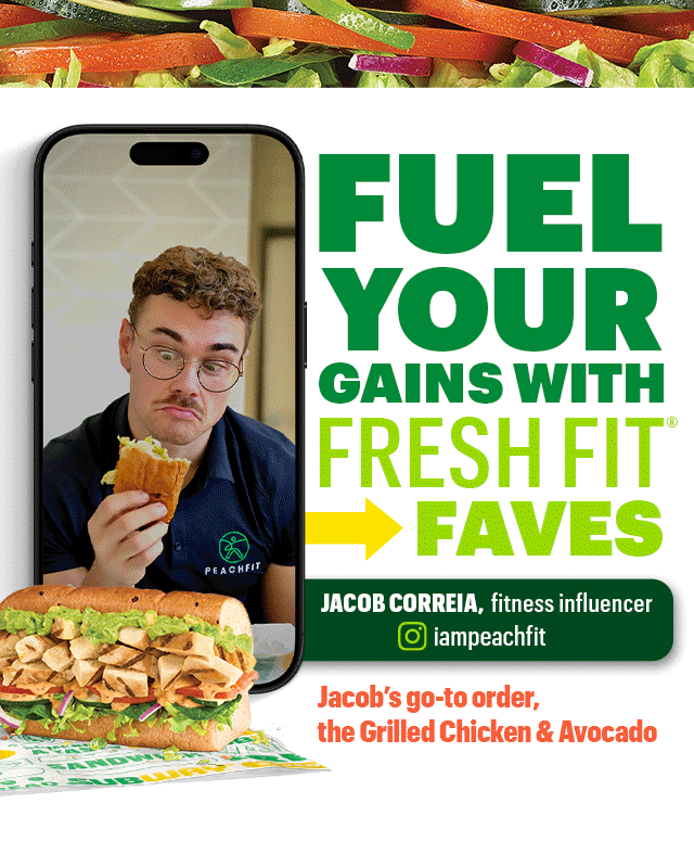 Promotional Subway® graphic featuring a person holding a Fresh Fit® sandwich on a smartphone screen, with the headline ‘Fuel Your Gains with Fresh Fit® Faves.’ Below, a description highlights Fresh Fit® subs as high‑protein options. The image showcases four stacked 6-inch sandwiches: Seasoned Steak & Avocado, Ham & Turkey Stacker, Grilled Chicken & Avocado, and Turkey & Ranch Delite. Nutrition callouts indicate protein amounts for each sub. The layout includes branded icons, a call-to-action button labeled ‘Order Now,’ and Fresh Fit® menu messaging.