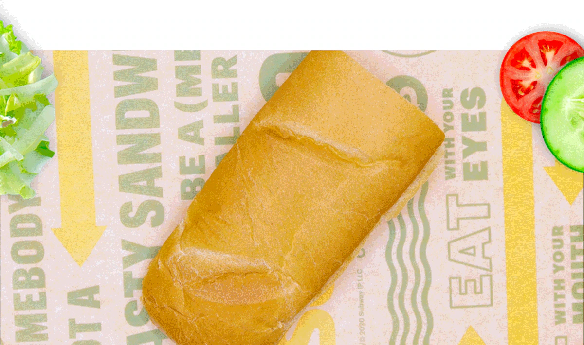 Promotional email for Subway®. The top section shows the headline ‘Eat Fresh®, Stay Fresh’ above a six inch sub on branded wrapping paper, surrounded by lettuce, sliced cucumbers and tomatoes. A caption reads: ‘From fresh-sliced veggies to fresh baked bread, and fresh‑sliced meat—your faves are always fresh‑made.’. A yellow button below says ‘Build Your Sub.’. The next section contains multiple behind‑the‑scenes images of food prep stations, fresh sliced vegetables, sliced meats, and Subway®sandwich assembly. A green headline reads: ‘Behind the scenes with our Sandwich Artists.’. The bottom section highlights ingredients with callouts pointing to tomatoes, bread, and meats on a fully assembled sub, with text describing tomatoes picked at peak ripeness, bread baked daily, and a selection of freshly sliced meat. Overall image promotes freshness and ingredient quality.